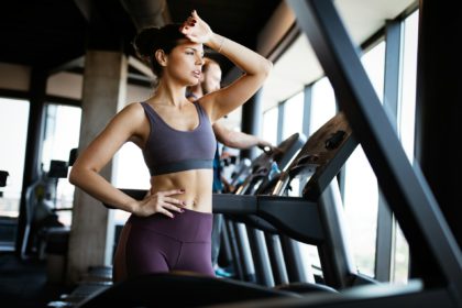 Disappointed tired woman trying to reach fitness goals by endurance and stamina training